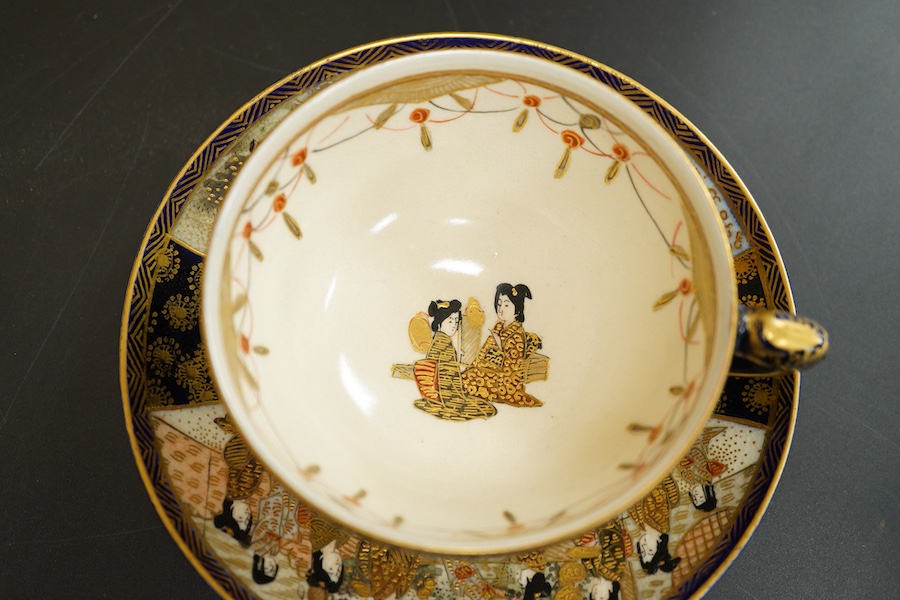 A Japanese satsuma pottery cup and saucer, saucer 14cm in diameter